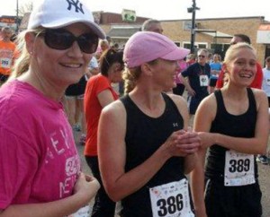 Carrie (center) and her daughter Alyssa (right) before the Tulip Festival 5K; photo by Darren Marker